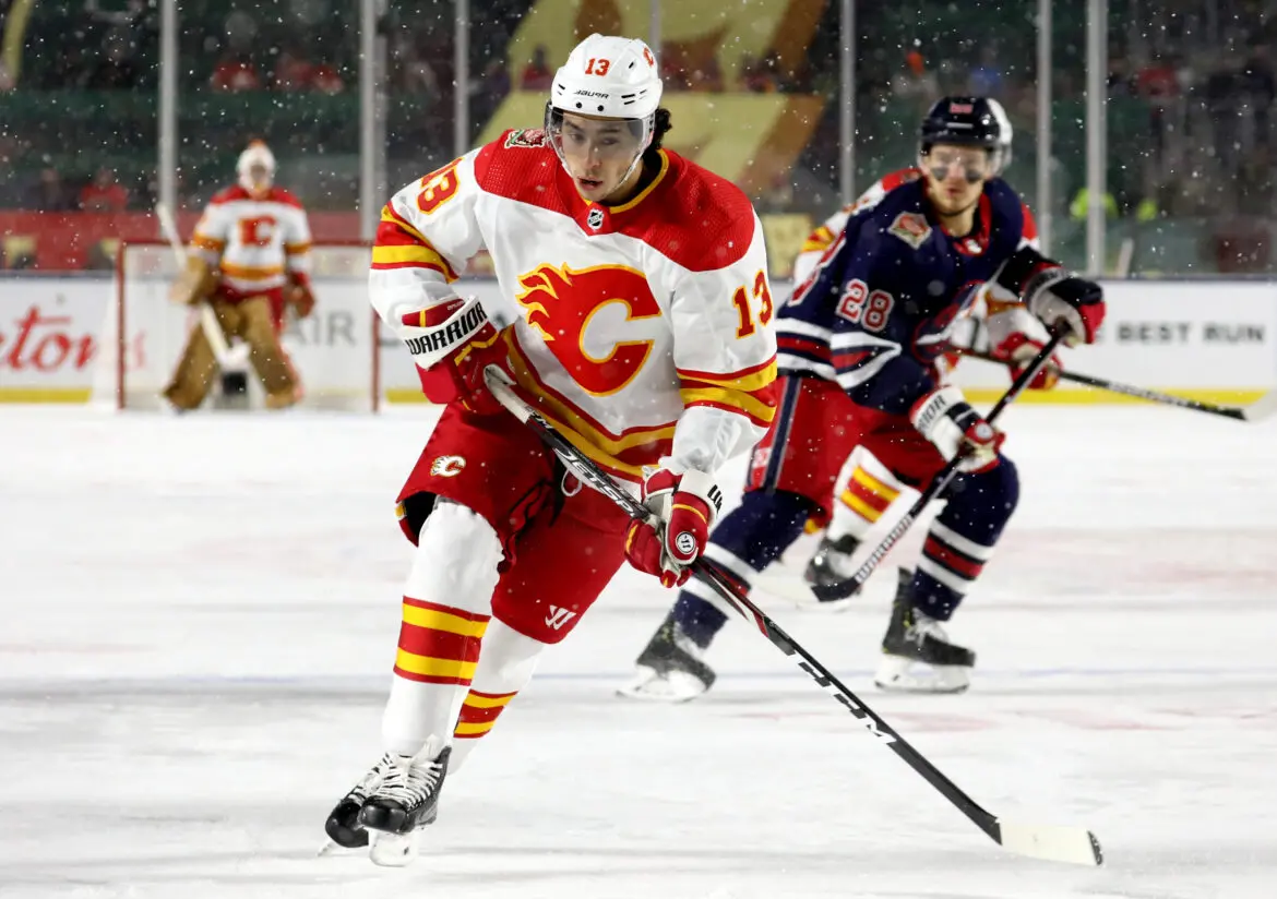 Hockey players in action on the ice rink during a game.
