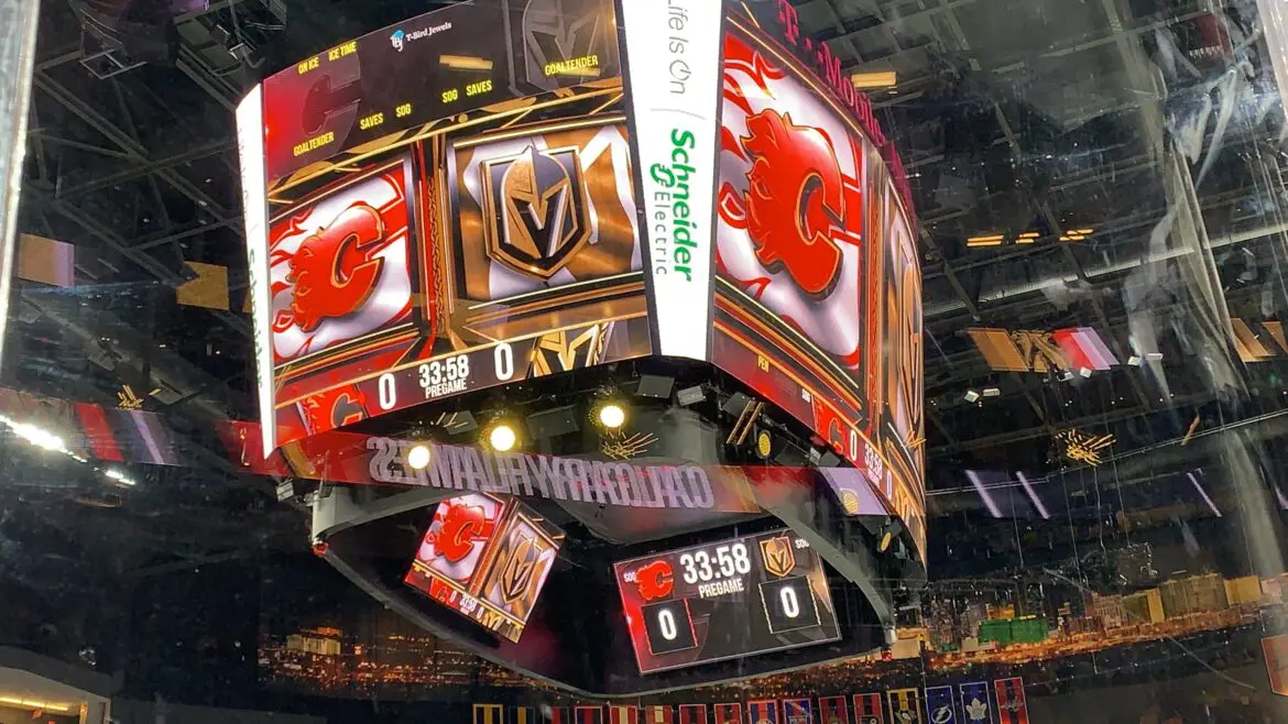 Close-up of a Vegas Golden Knights scoreboard at a hockey arena.