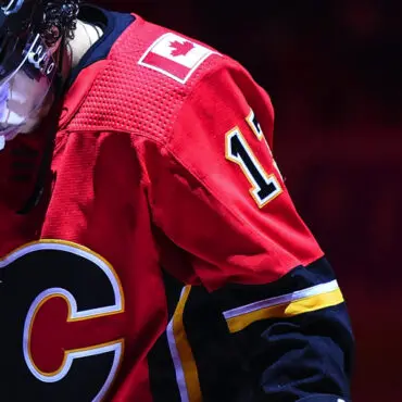Close-up of a Calgary Flames hockey jersey with number 12.