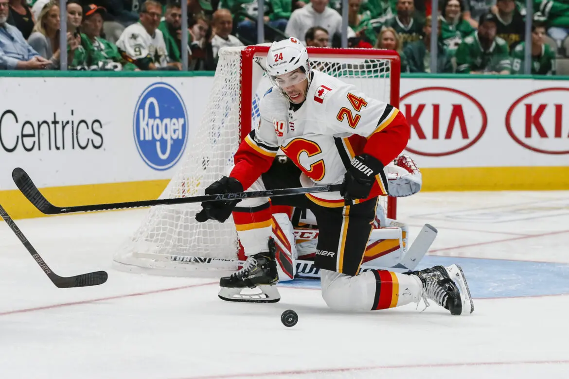 Hockey players in action during a game near the goal.