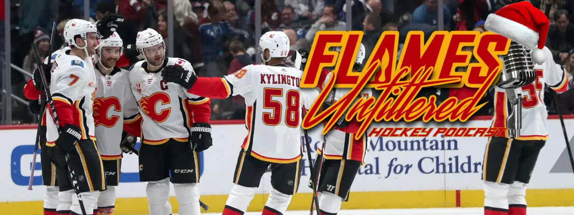 Calgary Flames players celebrating a goal during a hockey game.