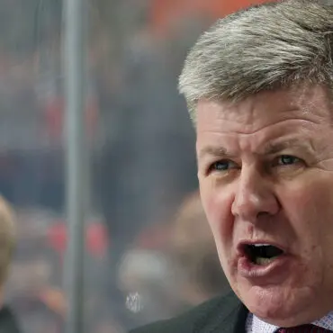 A man passionately speaking or shouting during an event.