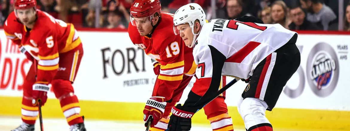 Two ice hockey players in action during a game.