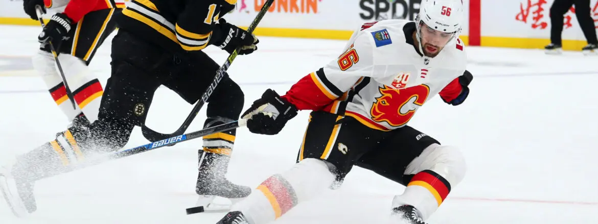 Two ice hockey players competing on the ice rink.