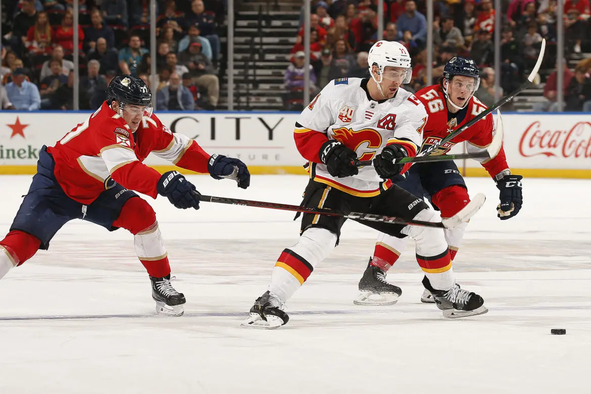 Ice hockey players in action during a game.