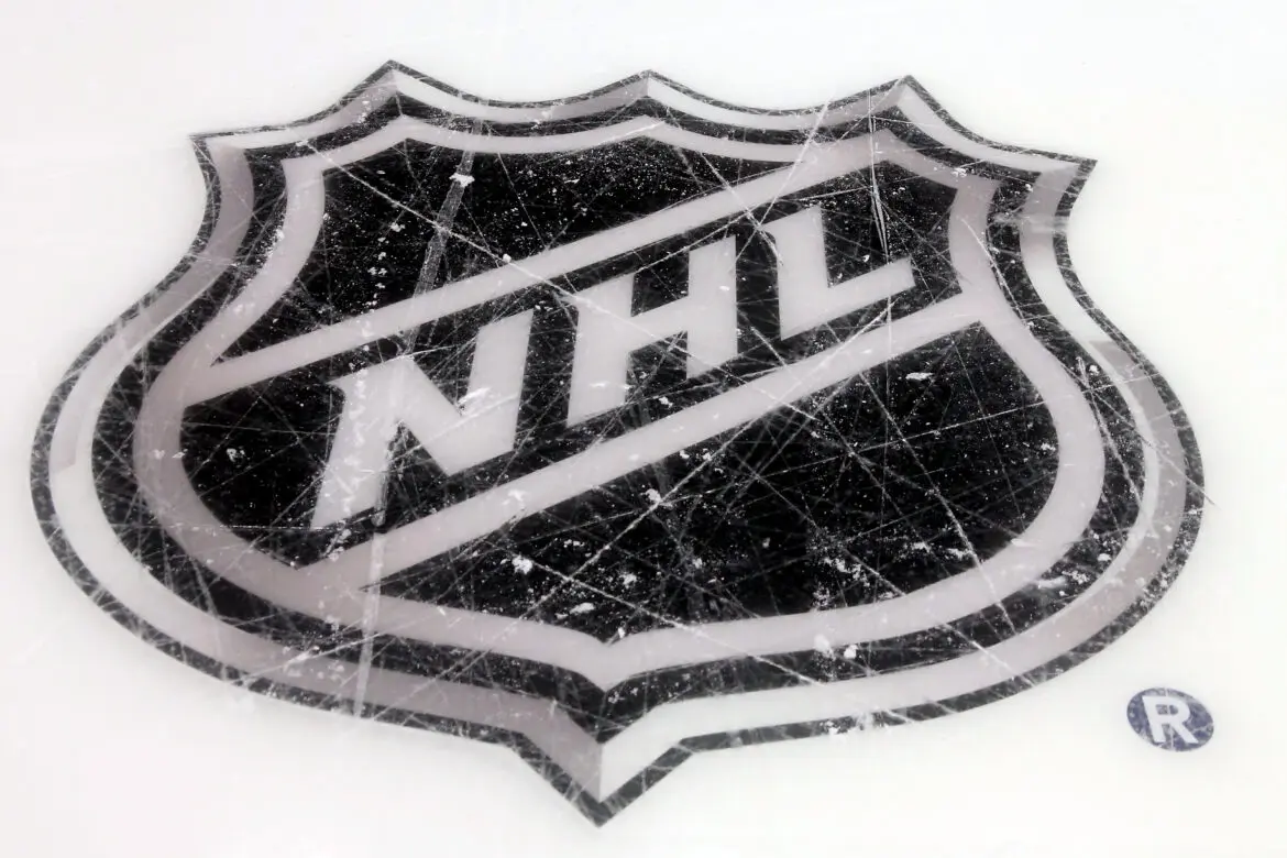 NHL logo painted on an ice hockey rink.