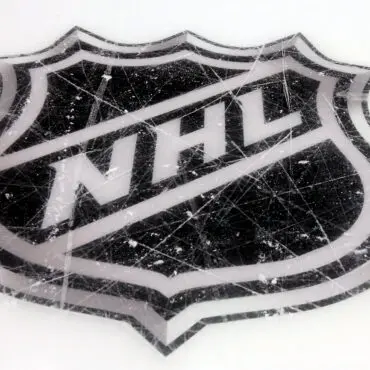 NHL logo painted on an ice hockey rink.