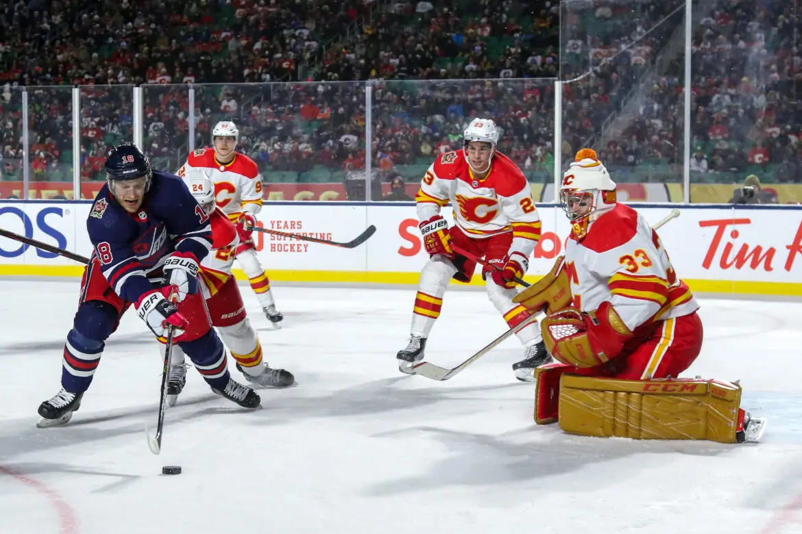 Hockey players in action near the goal during a match.