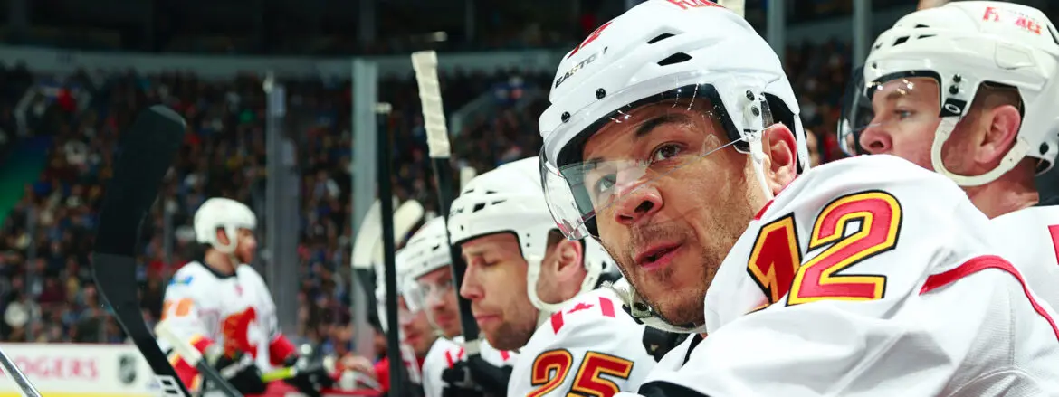 Ice hockey players focused during a game.