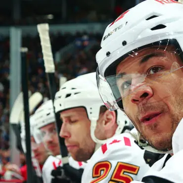 Ice hockey players focused during a game.