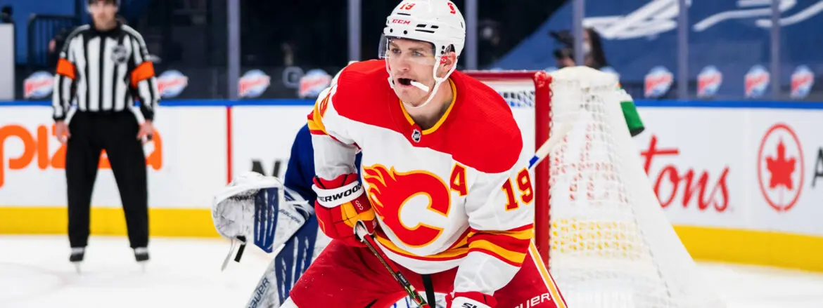 Calgary Flames hockey player in action on the ice rink.