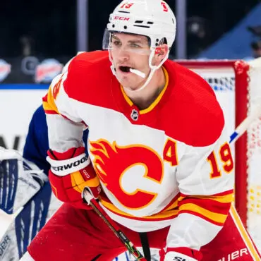 Calgary Flames hockey player in action on the ice rink.