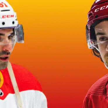 Two ice hockey players facing each other against an orange background.