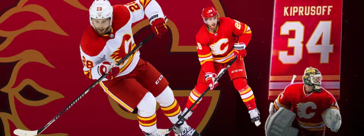 Two Calgary Flames hockey players in action on the ice.