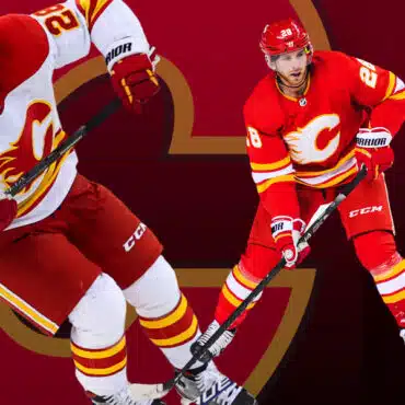 Two Calgary Flames hockey players in action on the ice.