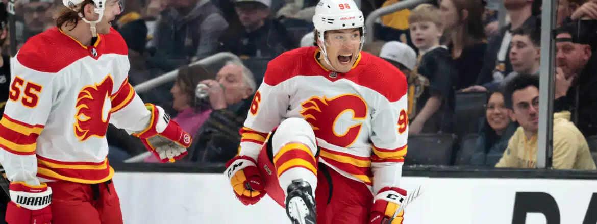 A Calgary Flames hockey player celebrating on the ice.