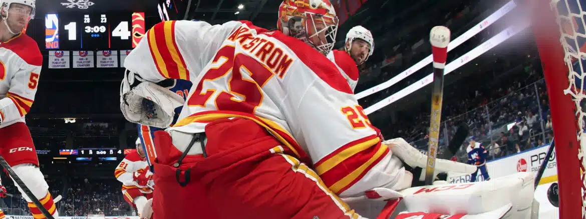 Hockey goalie making a save during a game.