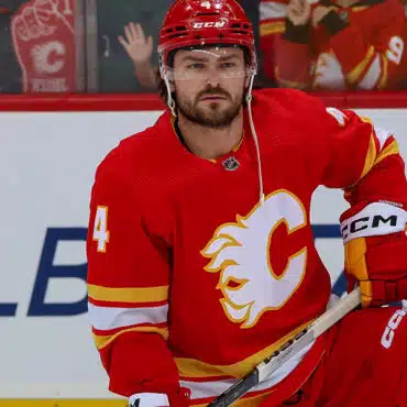 Calgary Flames hockey player in red jersey during a game.