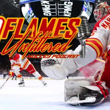 Hockey goalie in action during a fast-paced game against Calgary Flames.