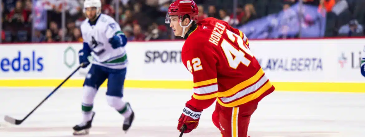 Hockey player in red jersey on ice during a game.