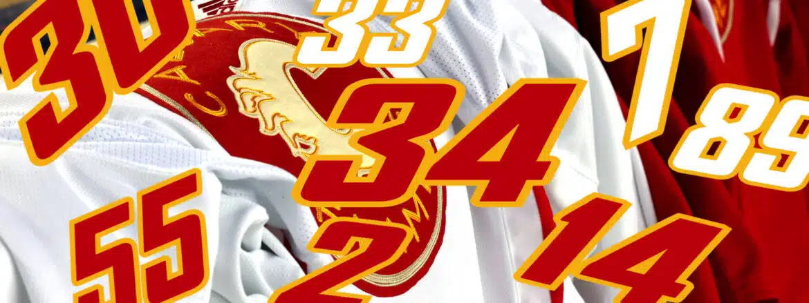 Close-up of a sports jersey with the number 34 and a Trojan helmet logo.