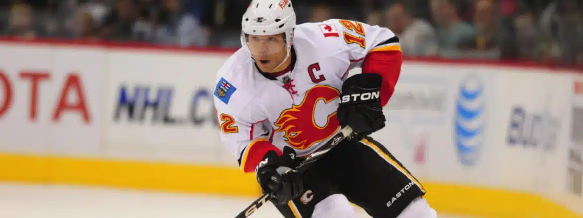 A Calgary Flames hockey player in action on the ice.