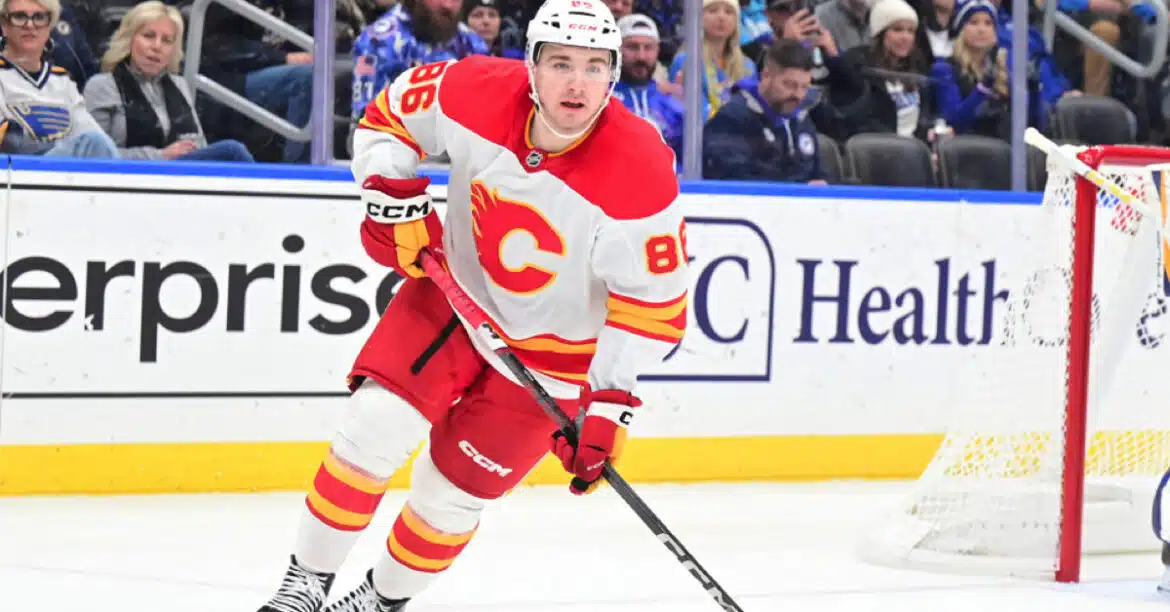 Hockey player in action wearing a Calgary Flames jersey.