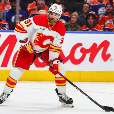 Calgary Flames hockey player in action during a game.