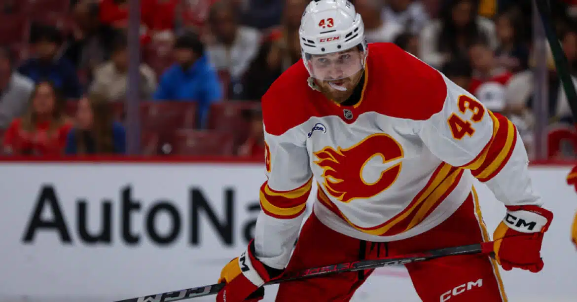 Hockey player from the Calgary Flames focused during a game.