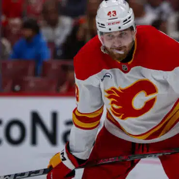 Hockey player from the Calgary Flames focused during a game.