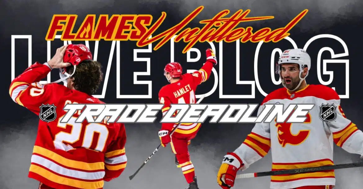 Ice hockey players in red and white uniforms celebrating on the rink.