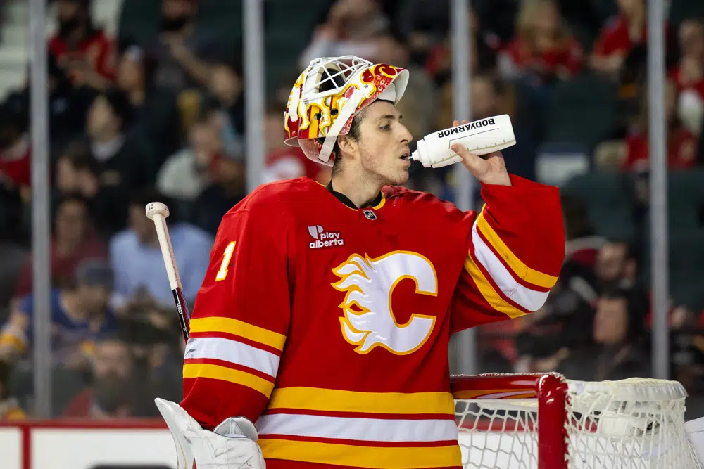 Purple podcast icon with a microphone symbol in the center.