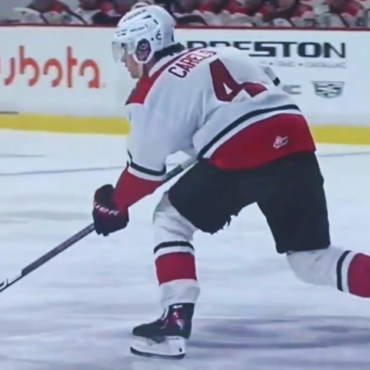 Hockey player taking a shot on ice